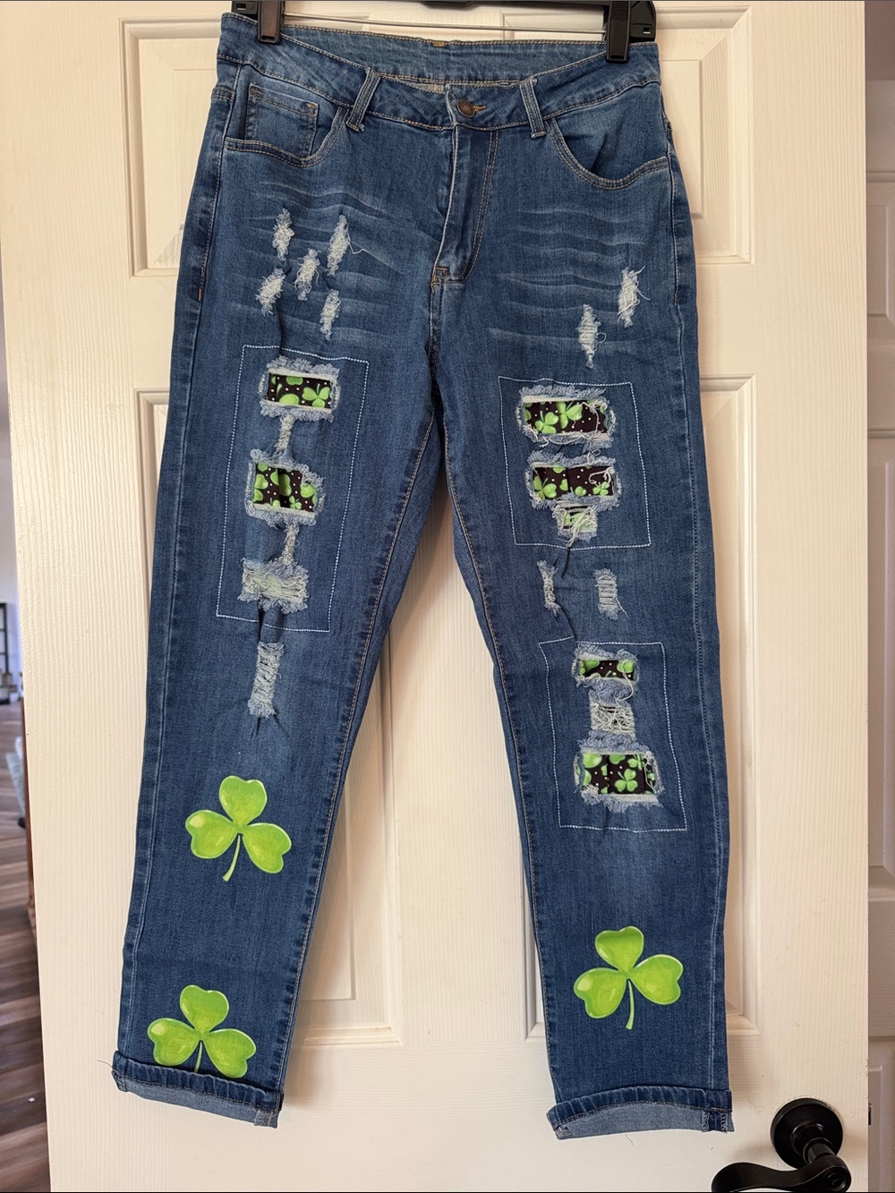 Women's Blue Distressed Boyfriend Jeans with Green Shamrock Accents